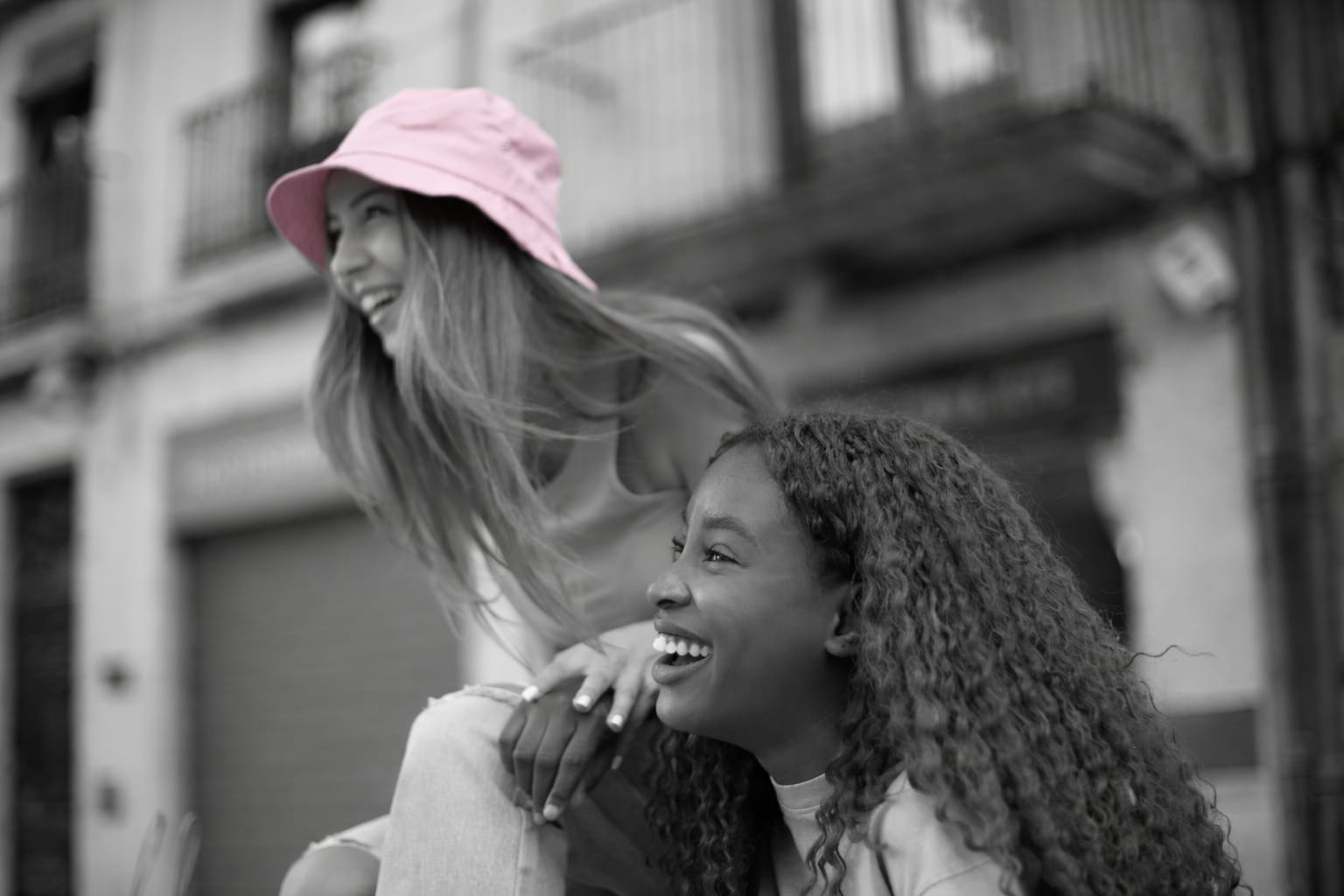 Woman trying on clothes in a fitting room mirror